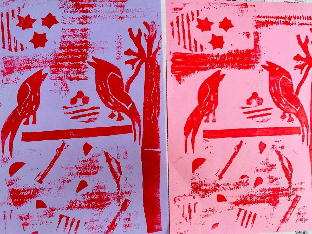 Red bird prints on lilac and pink paper